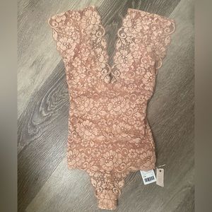 Women’s one piece lace lined bodysuit size XS NWT
